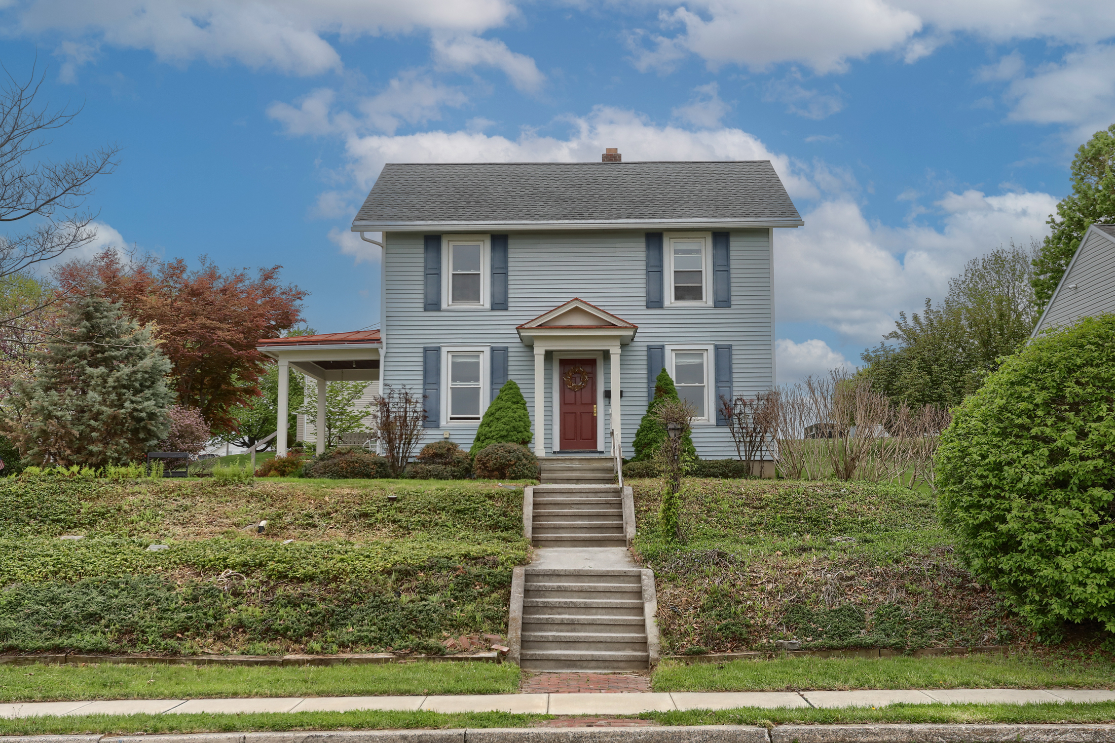 Front exterior of home for sale in Wernersville PA with attached garage on corner lot